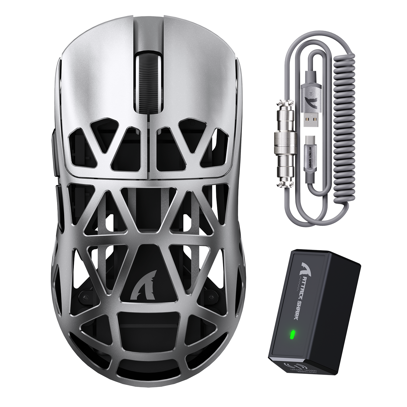 Silver wireless gaming mouse with geometric lattice design, accompanied by a coiled charging cable and black battery pack with green LED.