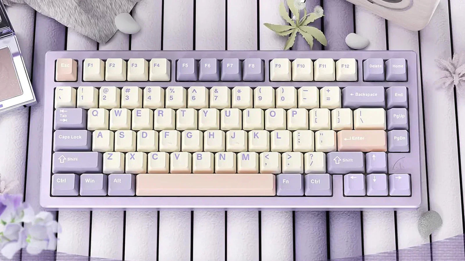 A compact mechanical keyboard with a pastel color scheme featuring light purple and cream keycaps. The keyboard has a 75% layout with function keys and arrow keys.